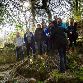 Group or people stood in some woods